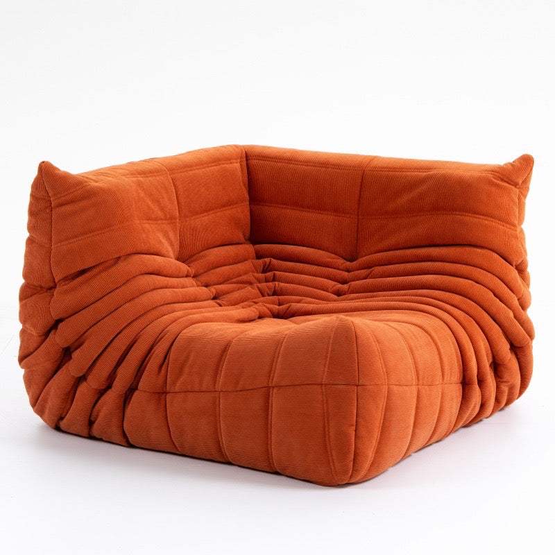 Modern orange corduroy corner sofa with plush cushioning and stylish design
