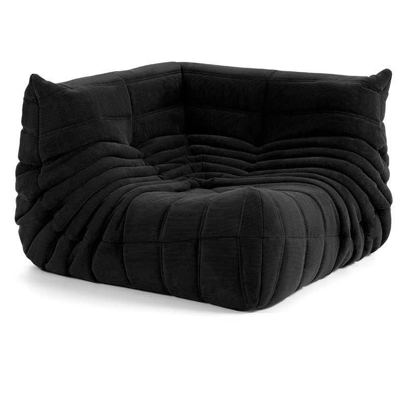 Black corduroy Caterpillar corner sofa with plush, quilted upholstery for modern living spaces