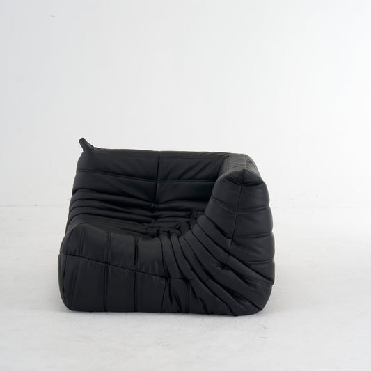 Luxurious leather Togo corner sofa in black, customizable colors, ergonomic design.
