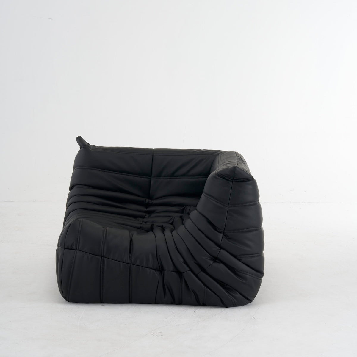 Black customizable leather Caterpillar corner sofa with ergonomic design and plush cushions