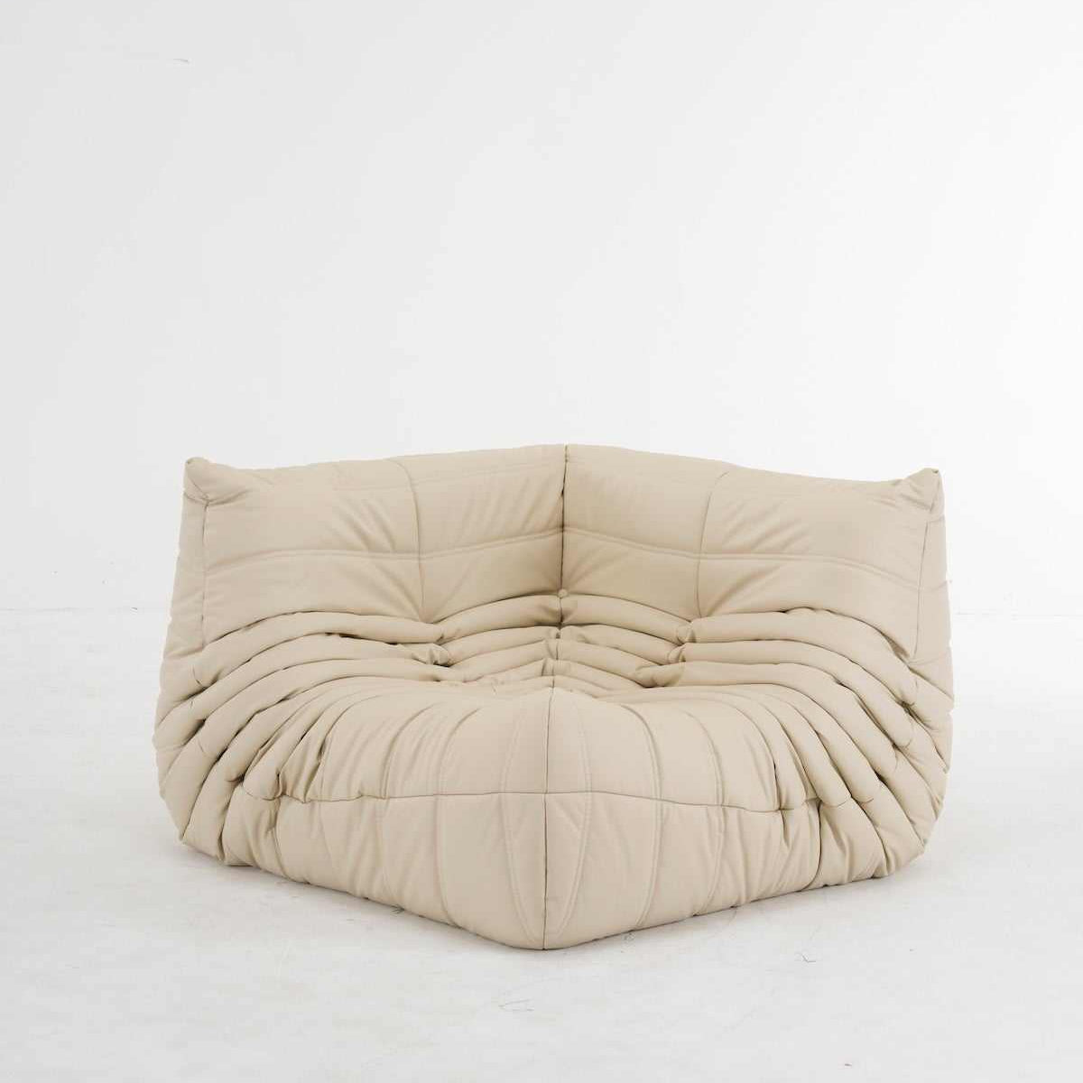 Beige customizable leather corner sofa with ergonomic design and plush cushions