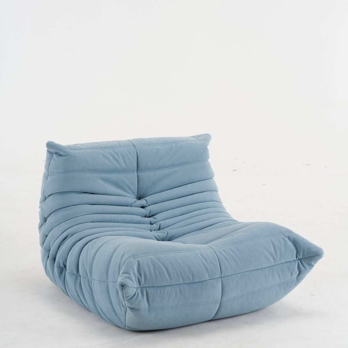 Blue Togo Chair with soft upholstery and ergonomic design for lumbar support