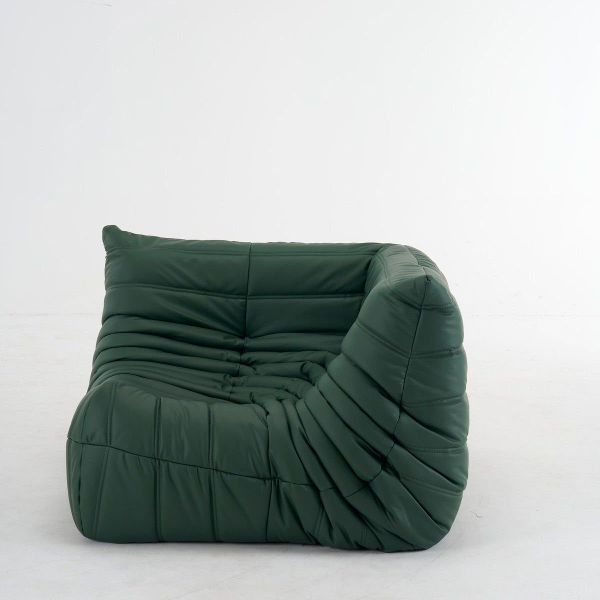 Green customizable leather Caterpillar corner sofa with ergonomic design and plush cushions