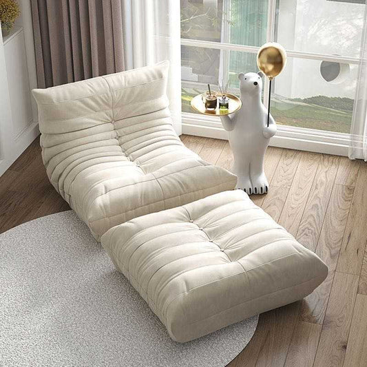 cream suede armchair and ottoman set in modern living room with unique bear side table