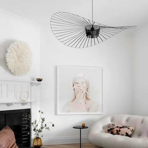 Modern Straw Hat LED Ceiling Light with sleek black wireframe design in minimalist living room