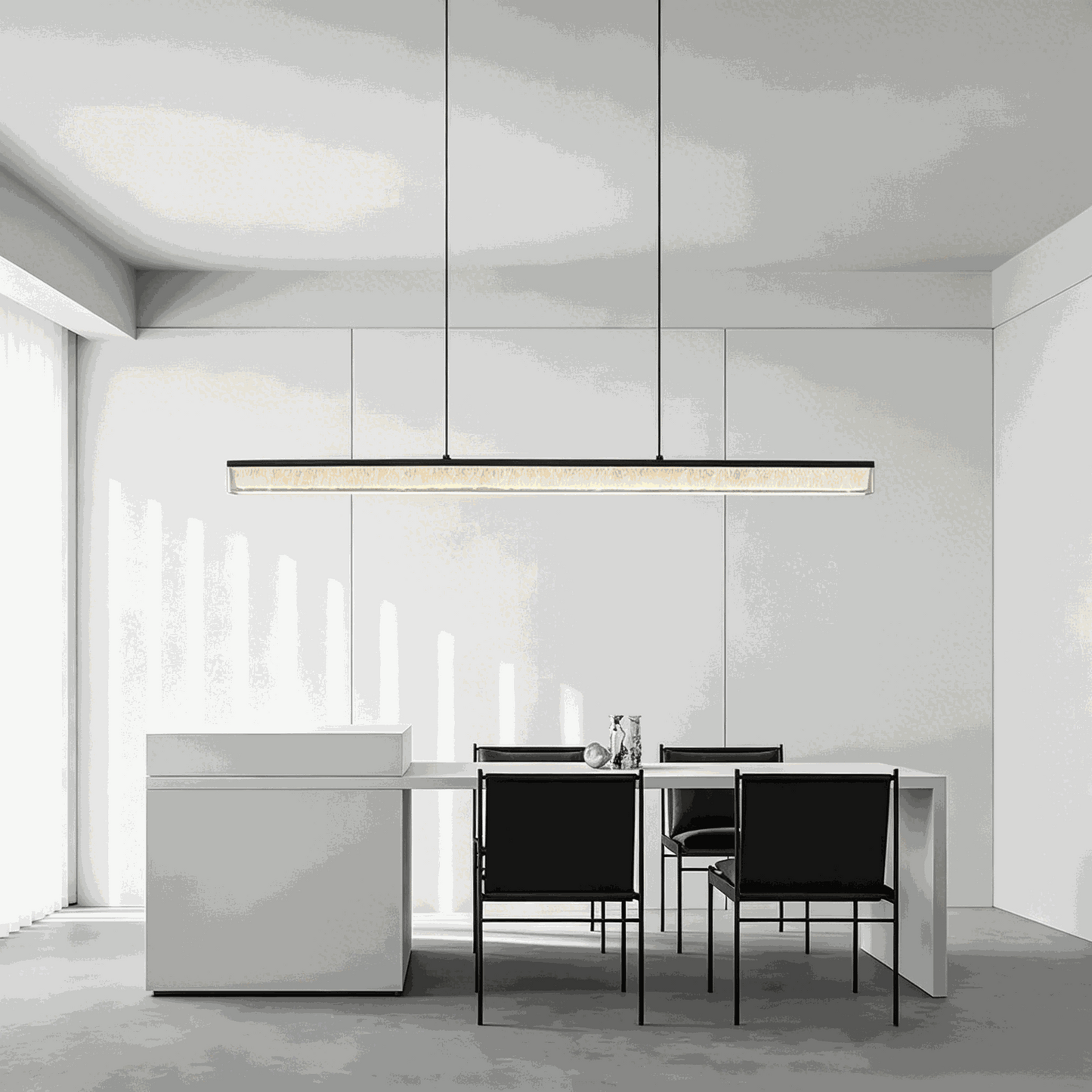 Italian minimalist adjustable linear pendant lamp with matte black iron frame and acrylic shade over dining table