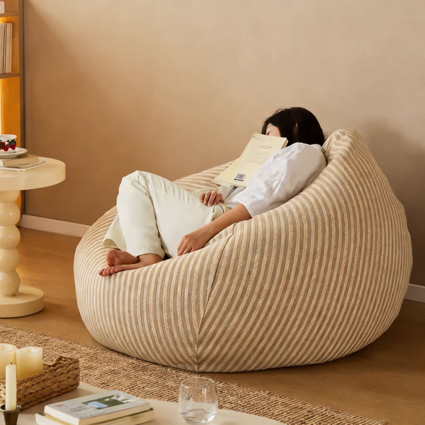 Japanese-style striped lazy sofa with reclining floor chair and matching footstool in bedroom setting