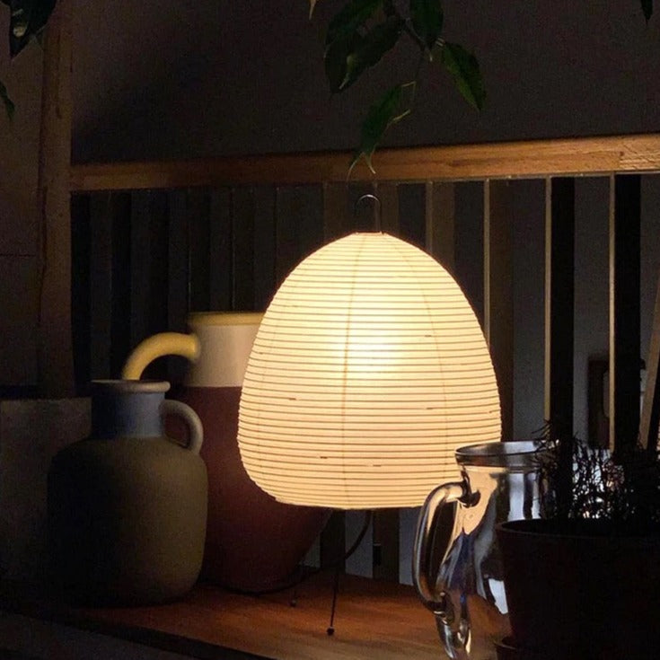 Traditional Japanese rice paper lamp with wooden frame, emits warm light, ideal for modern and Wabi-sabi decor - sparkledecor.com