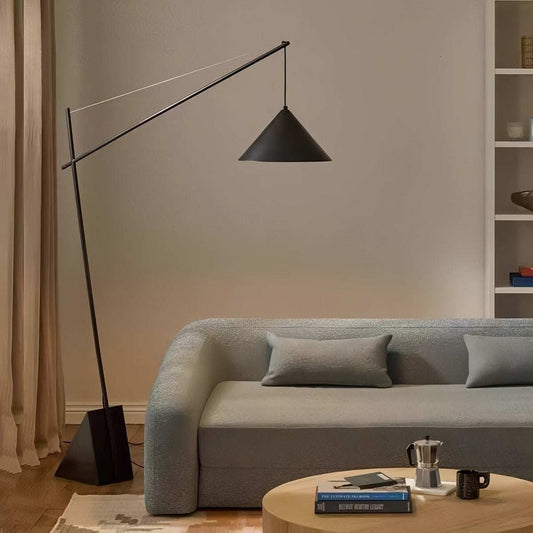 Minimalist floor lamp with sculptural design providing soft ambient light for modern living rooms and bedrooms