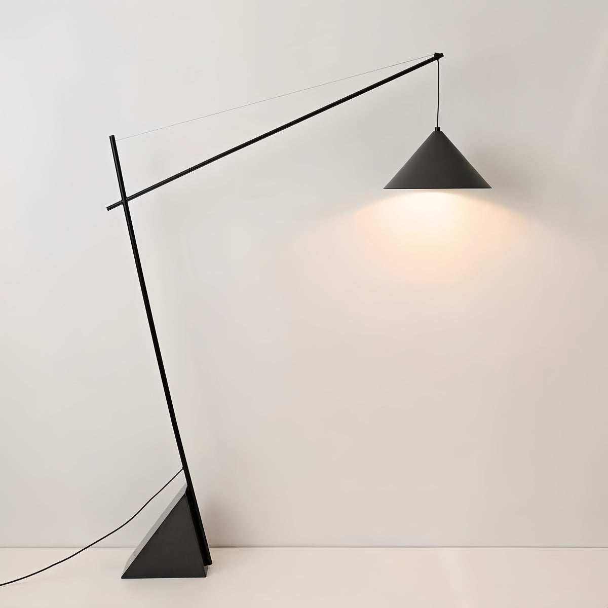 Minimalist Italian floor lamp with sculptural design and soft ambient light for modern living rooms and bedrooms