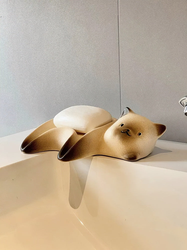 Ceramic cat soap dish with Siamese cat design and drainage grooves on bathroom vanity