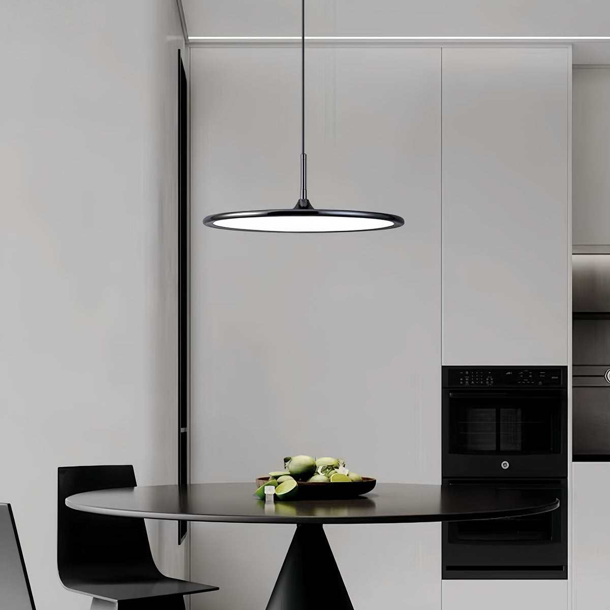 Minimalist Dining Pendant Light above modern round dining table in sleek kitchen interior