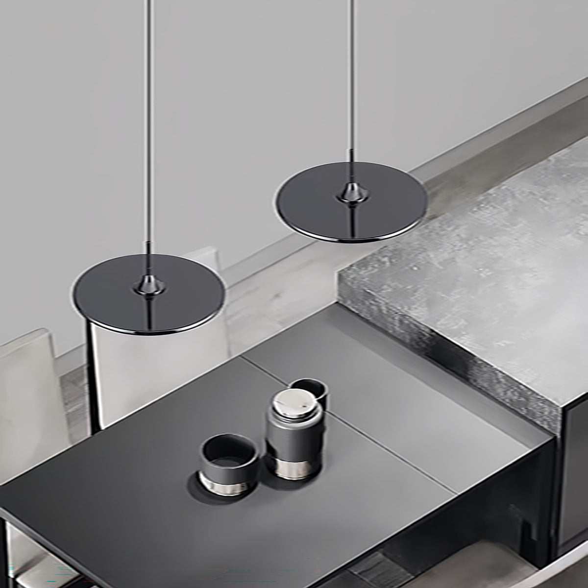 Minimalist dining pendant light with black round design above modern kitchen island
