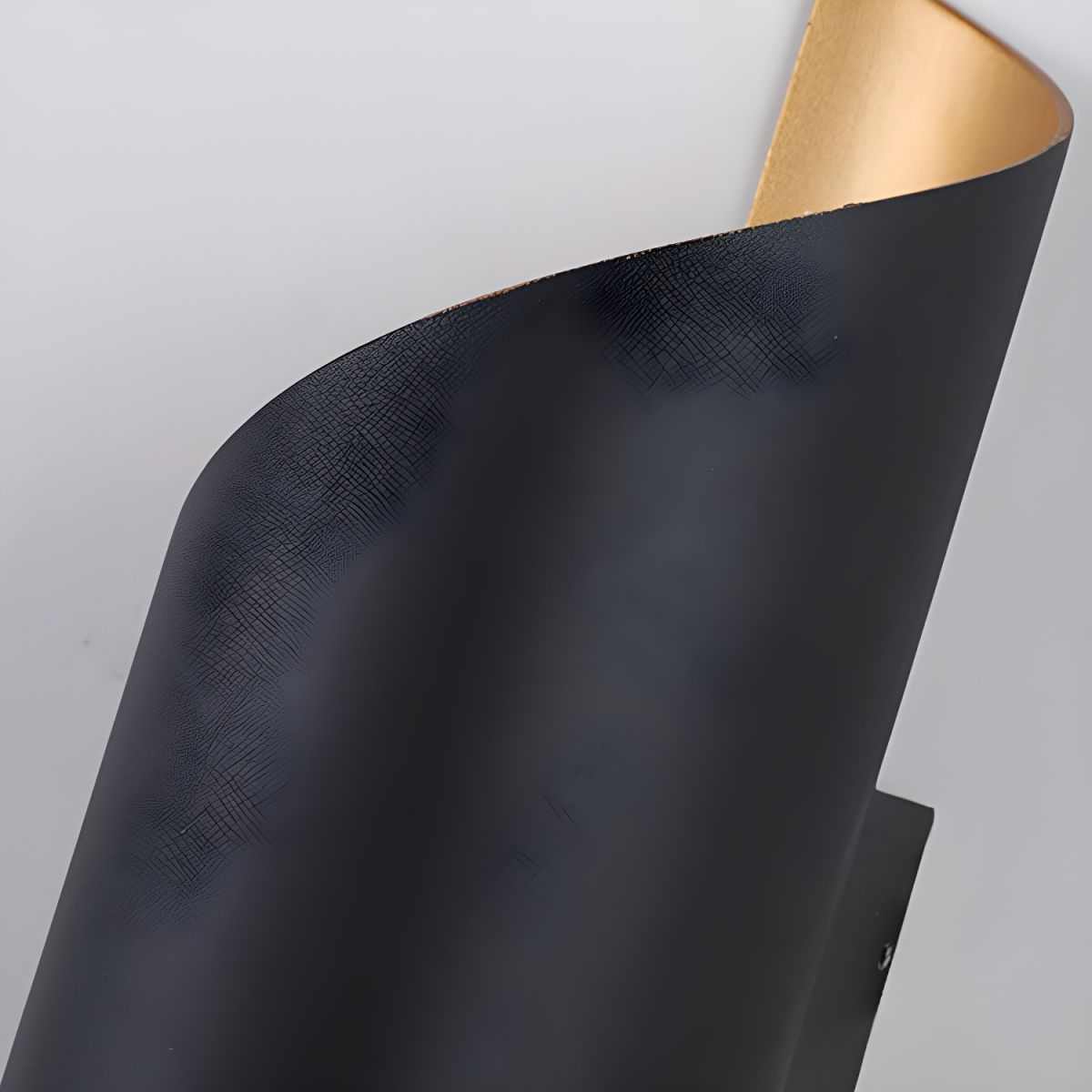 Postmodern unique sconce light with black and gold metal curved shade wall lamp for ambient bedroom and living room lighting