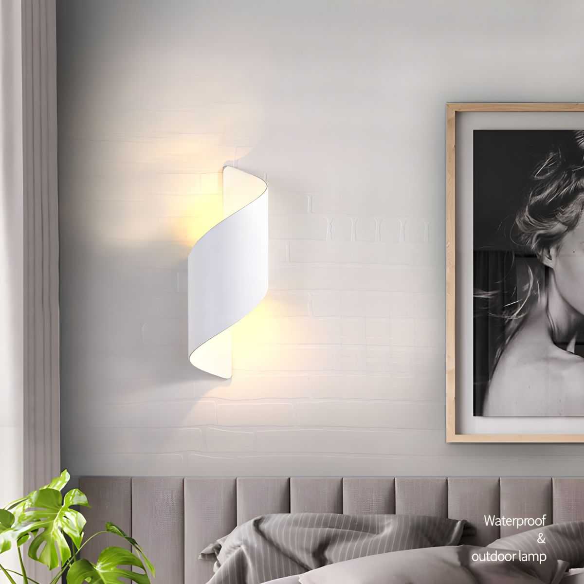 Postmodern unique sconce light with dual LED bulbs and curved white metal shade mounted on bedroom wall