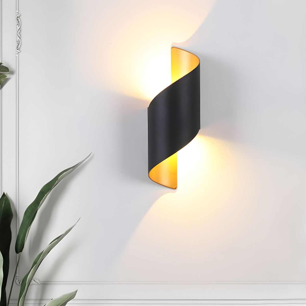 Postmodern unique black metal sconce light with ambient warm glow on white wall
