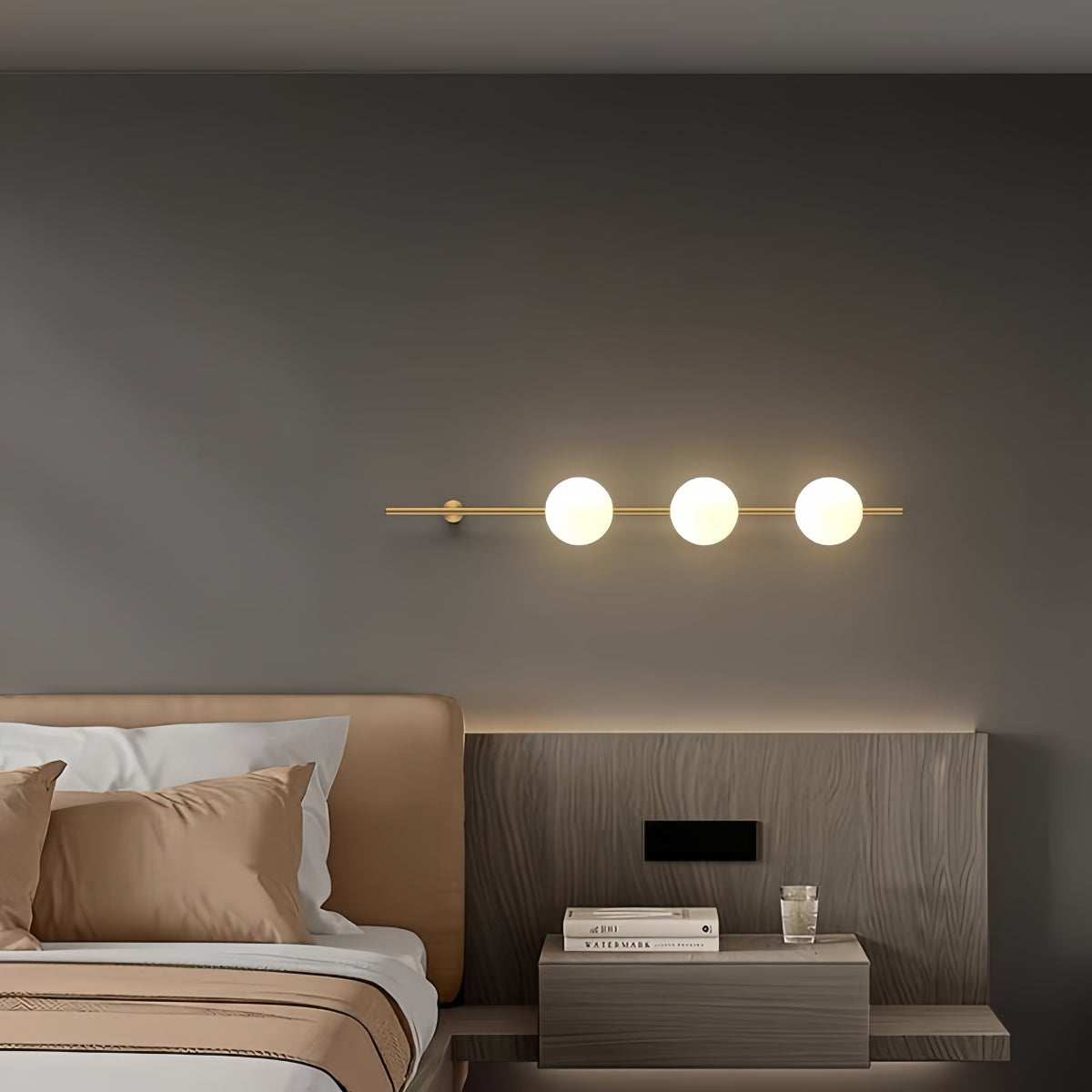 Minimalist brass wall sconce with cream glass shade and solid brass ceiling plate for elegant bedside lighting