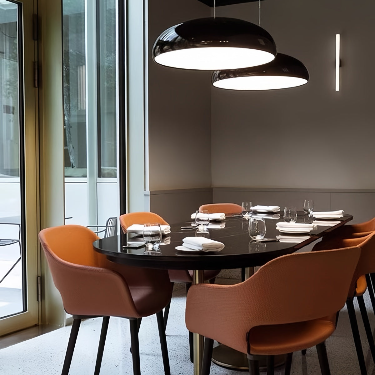 Modern minimalist red pendant light hanging in contemporary living room interior