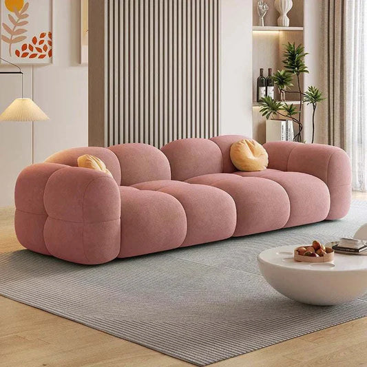 Modern pink Cloud sofa with plush rounded cushions and soft velvet fabric in stylish living room setting
