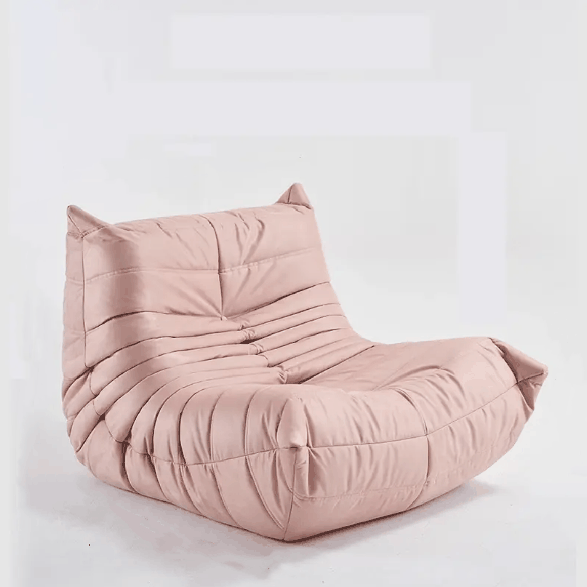 Pink suede velvet Togo Chair with high-density foam frame and ergonomic design for lumbar support