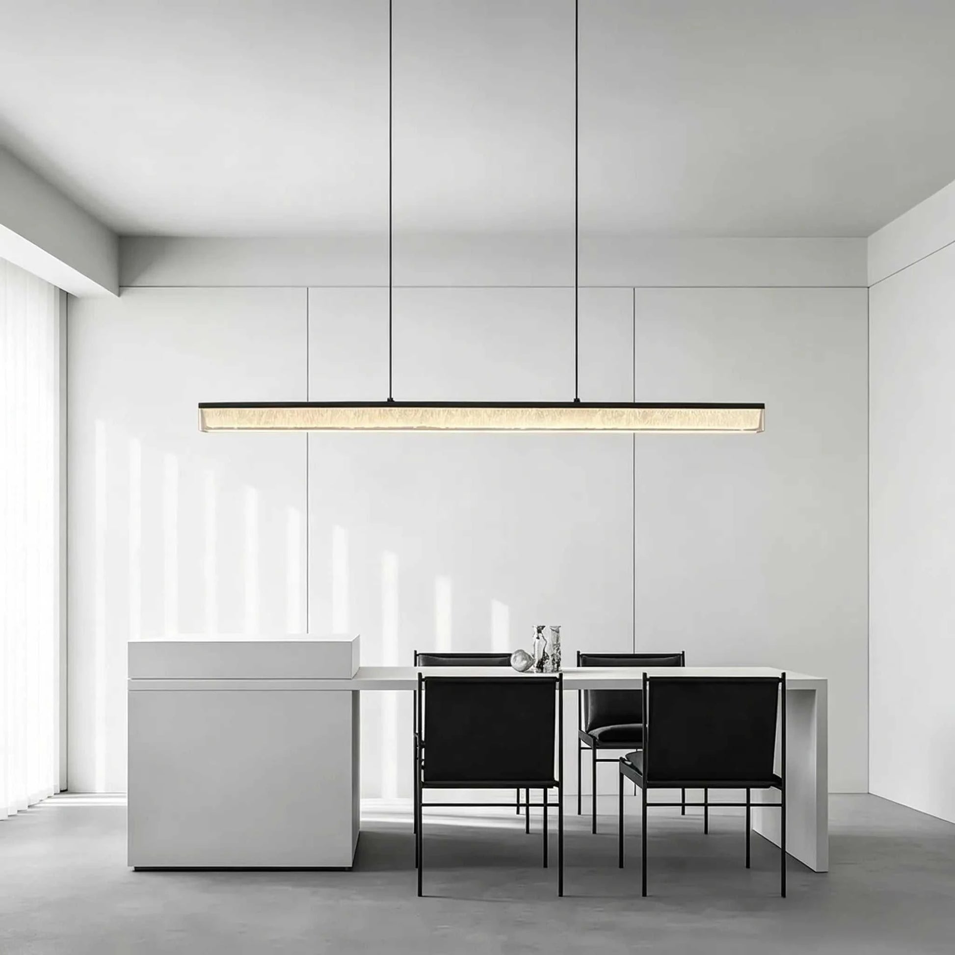 Italian Minimal Adjustable Linear Pendant Lamp with matte black iron frame and acrylic shade over dining table
