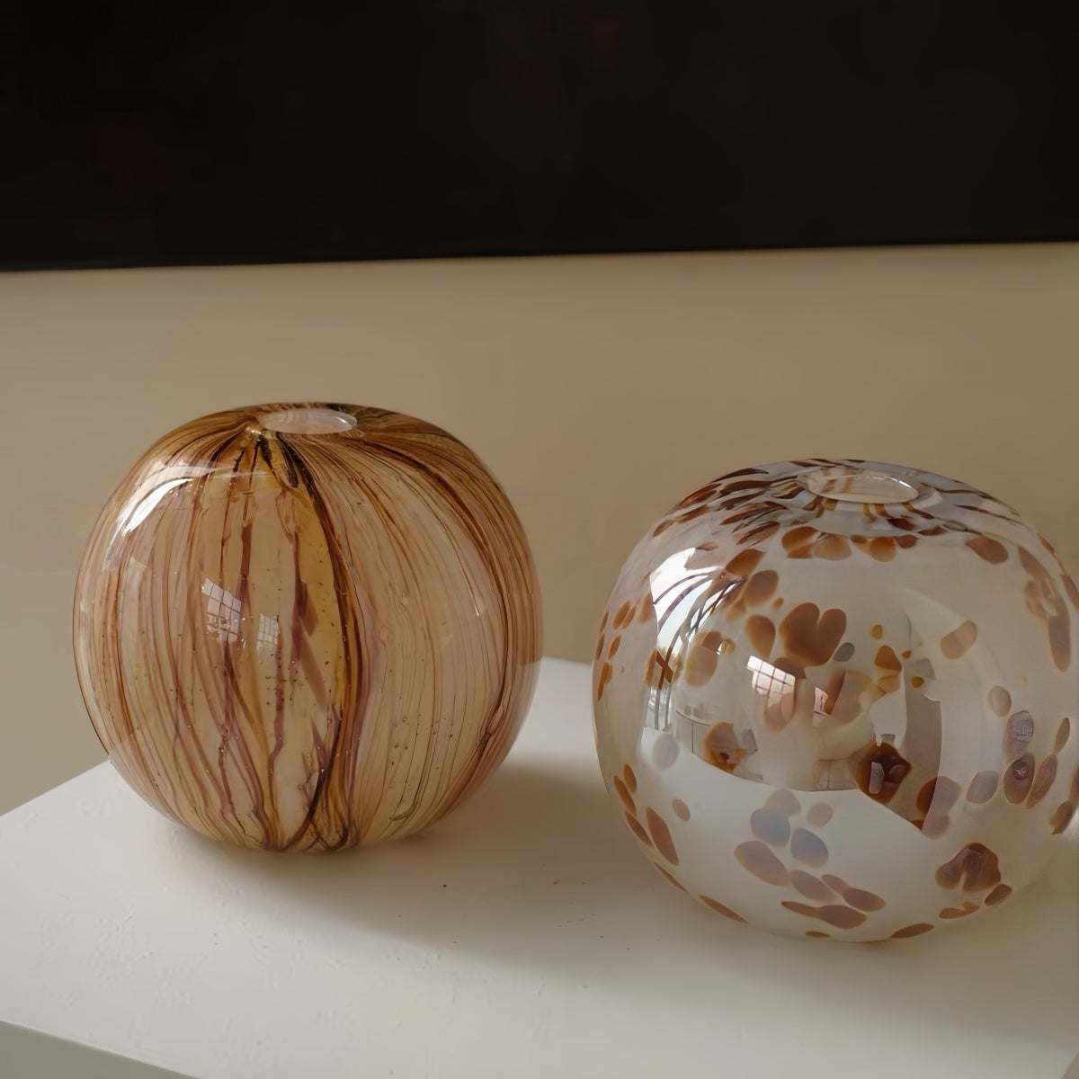 Handcrafted spherical textured art glass vase with vintage design for elegant decor and floral arrangements