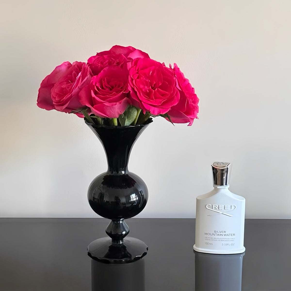 Vintage black glass vase with minimalist silhouette and dark smoked finish for elegant home decor