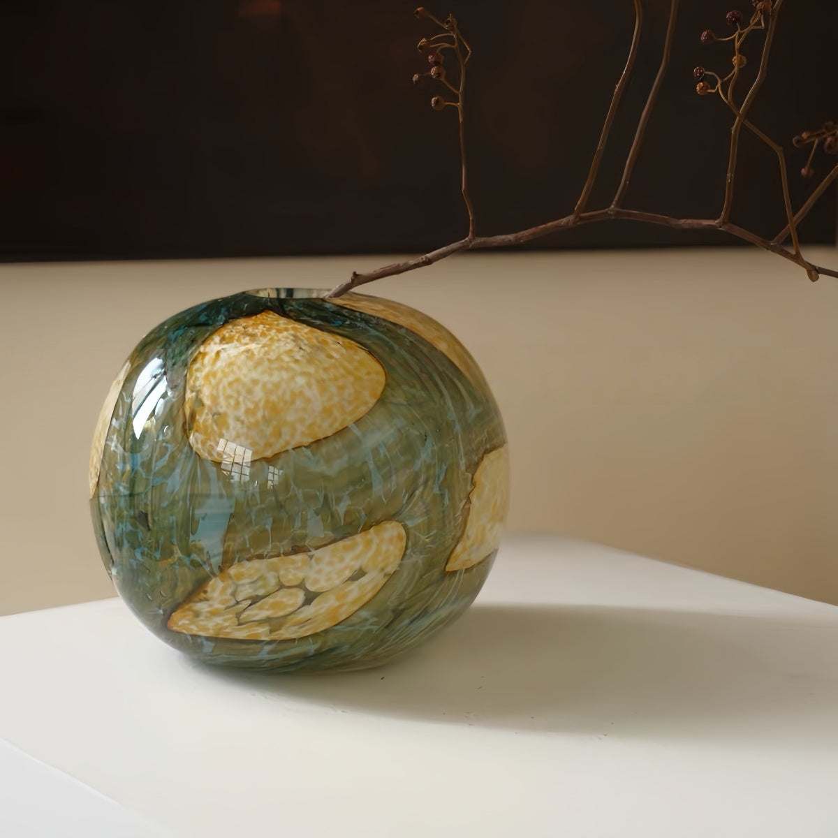 Spherical textured art glass vase with vintage design and layered finish for decorative floral display