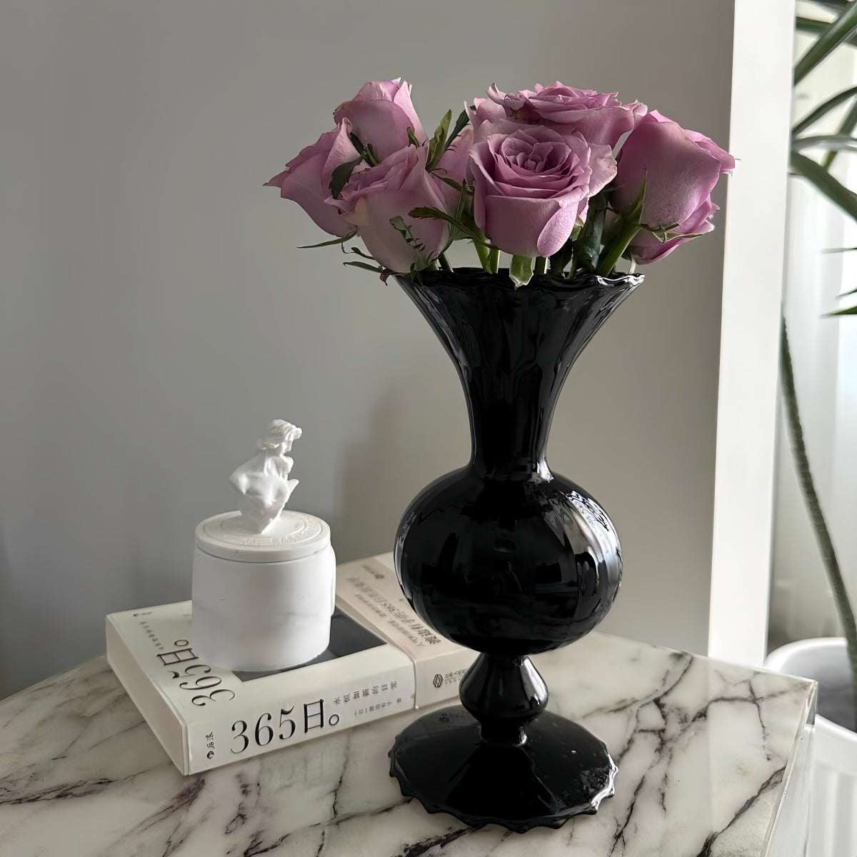 Vintage black glass vase with minimalist silhouette and dark smoked finish for home decor