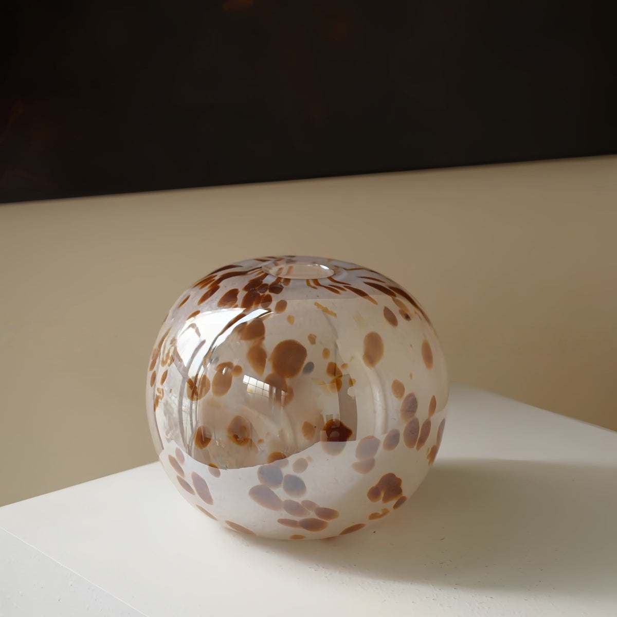 Handcrafted spherical textured art glass vase with vintage design for elegant decor and floral arrangements
