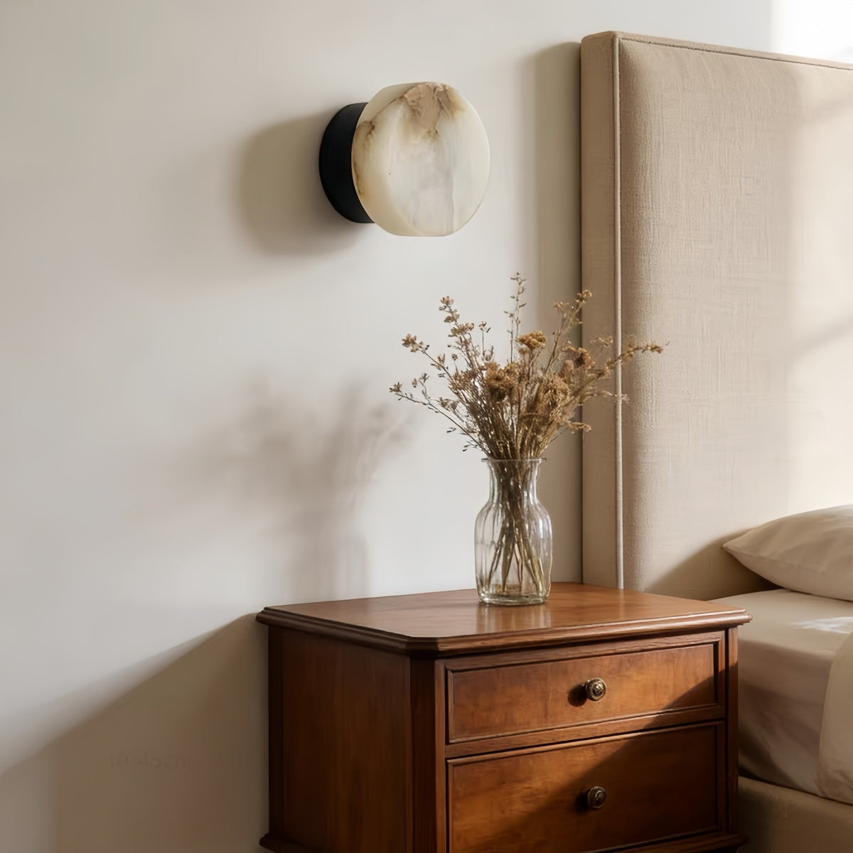 Natural Onyx Wall Lamp with minimalist round design and warm cream-toned glow