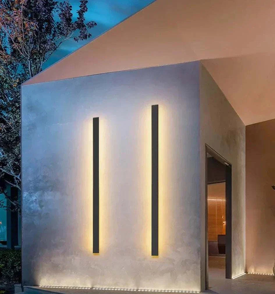 Waterproof IP65 outdoor wall light black aluminum modern LED vertical fixtures on exterior wall at night