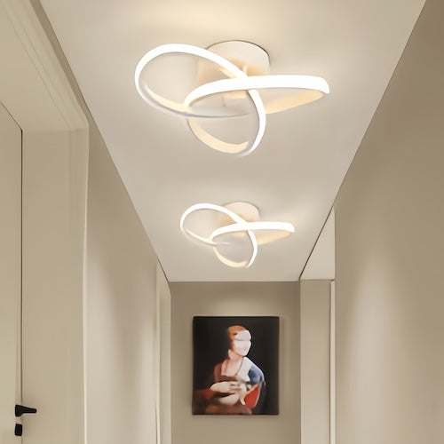 Modern energy-efficient LED ceiling lighting chandelier with stylish curved design in hallway