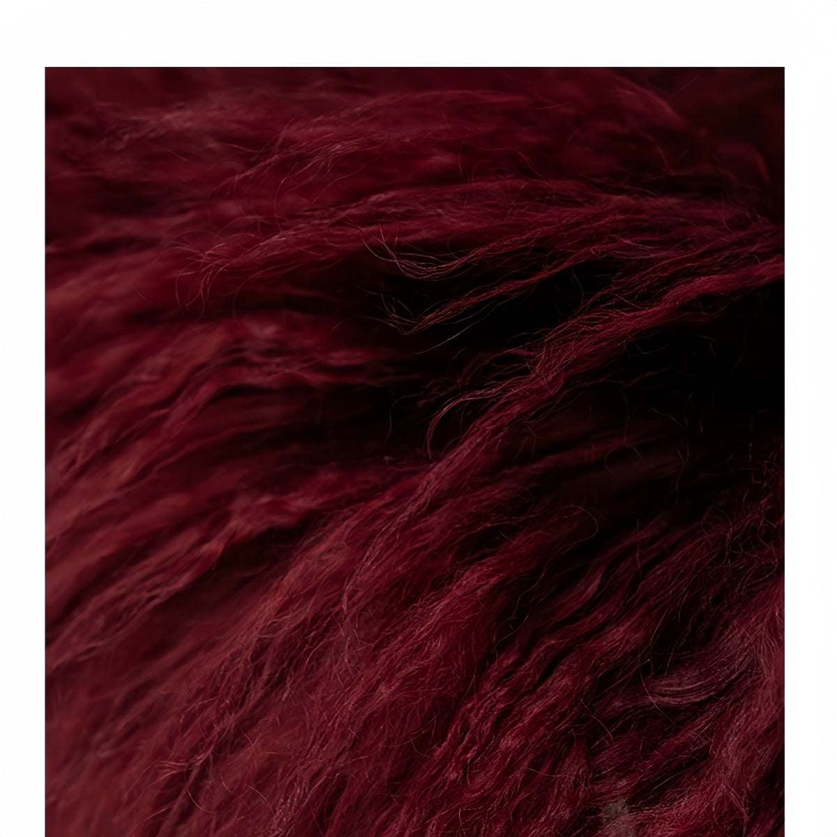 Modern minimalist burgundy lamb wool throw pillow with plush texture and full fluffy design for sofa and bed decor